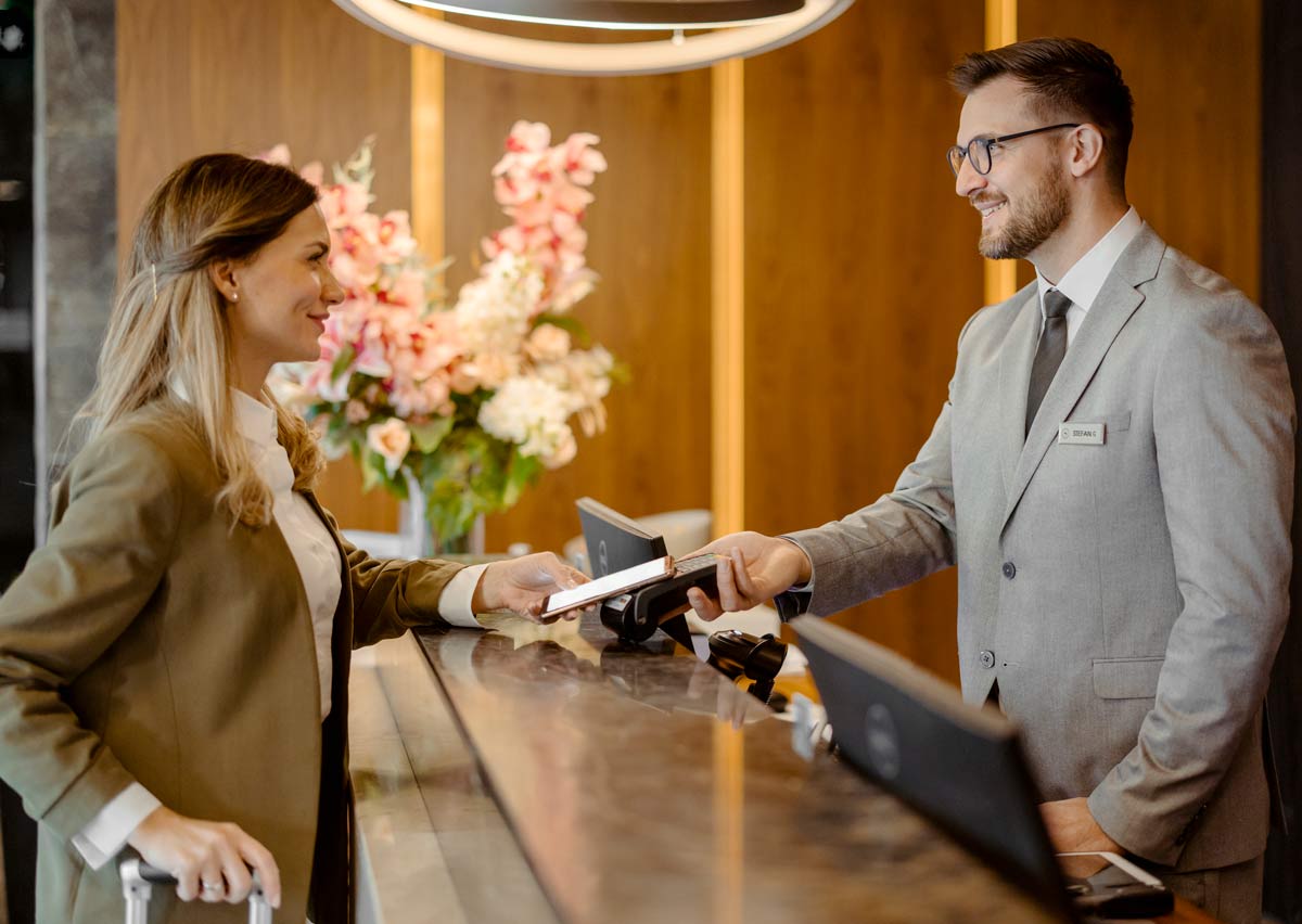 Woman checking in at a hotel