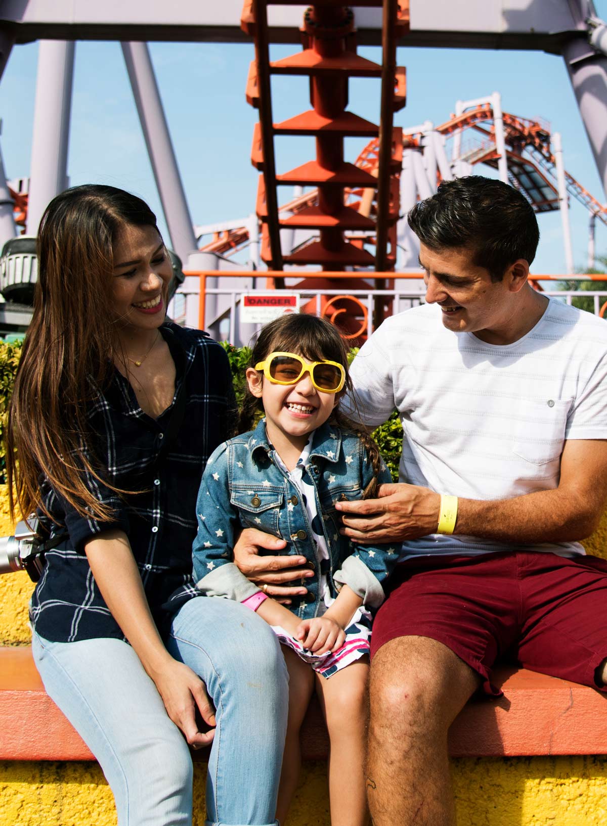 Family resting near a rollercoaster