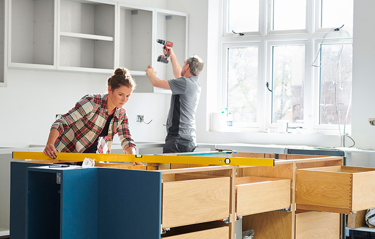 couple working on kitchen renovation