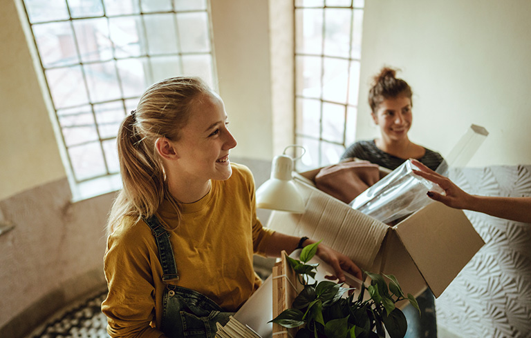 two young women moving