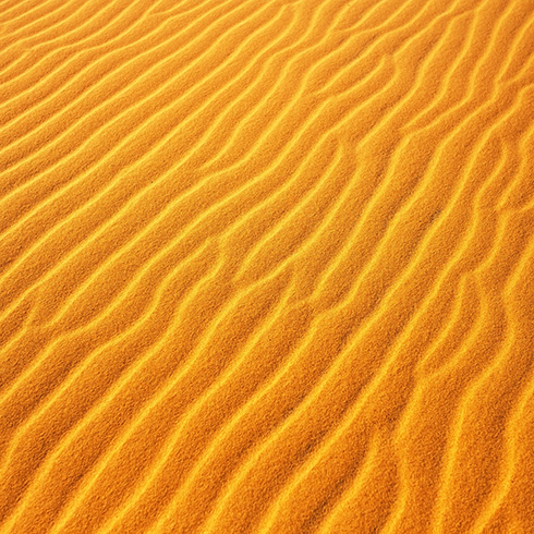 golden sand with a wavy texture