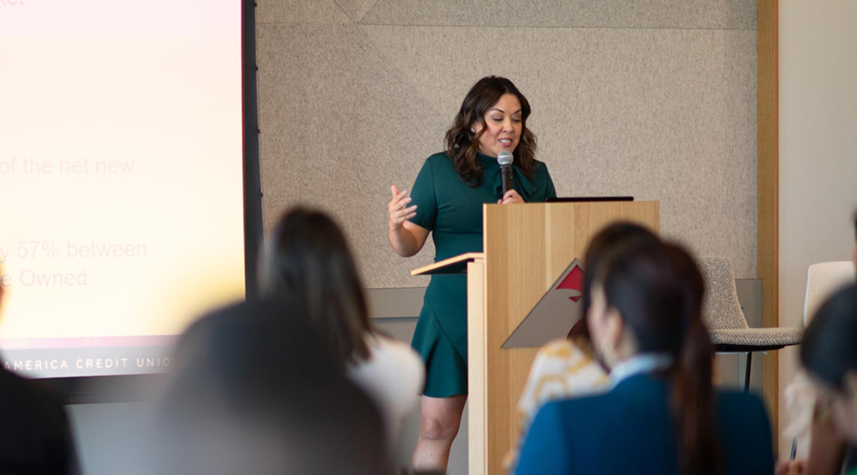 Woman giving a speech in conference room