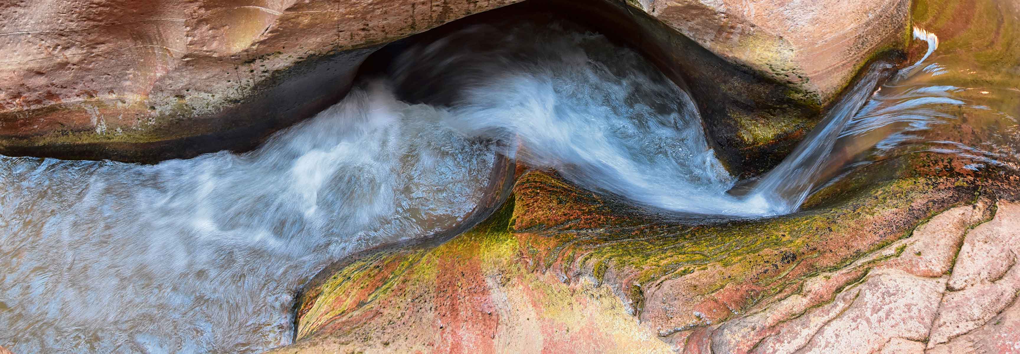 Water flowing through a stone canyon