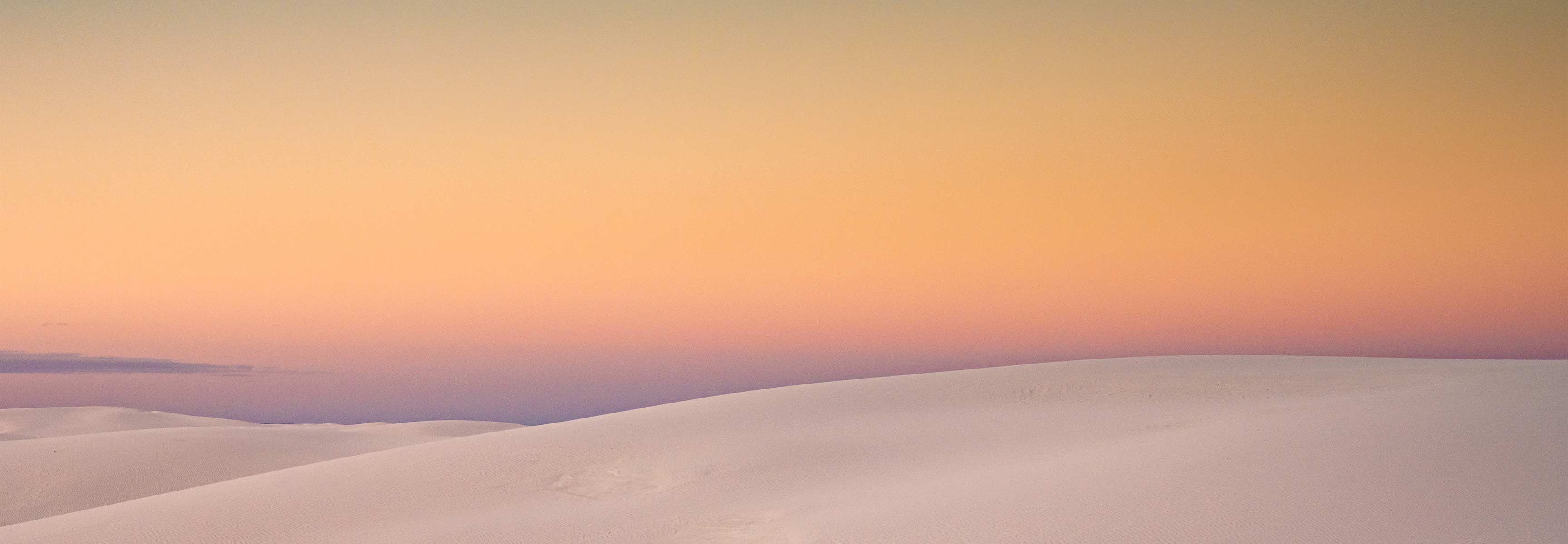 sunset over sand dunes