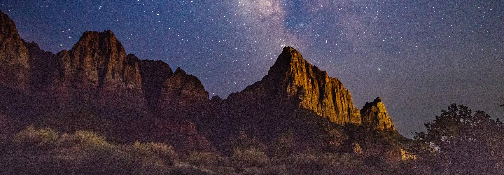 craggy mountain at night with stars