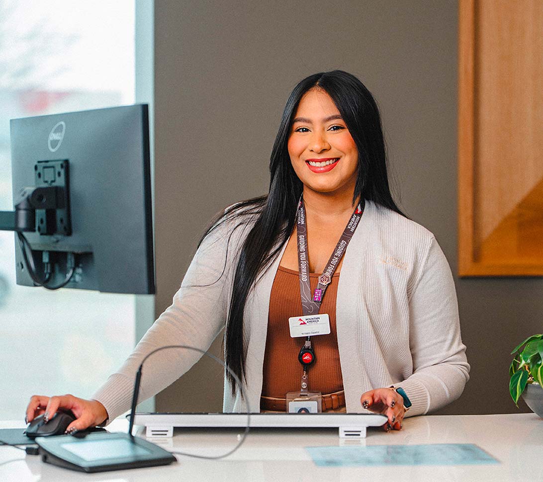 Female bank teller at a teller counter
