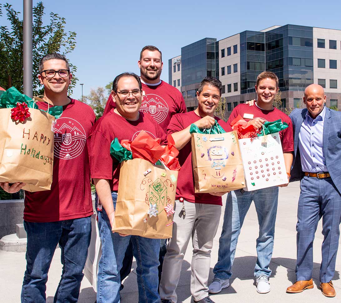 Volunteers carrying gifts