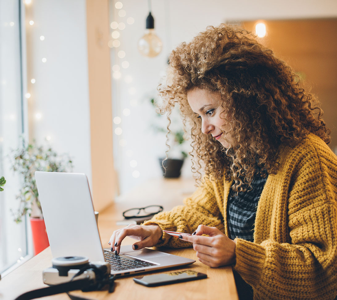 woman making an online purchase with her credit card