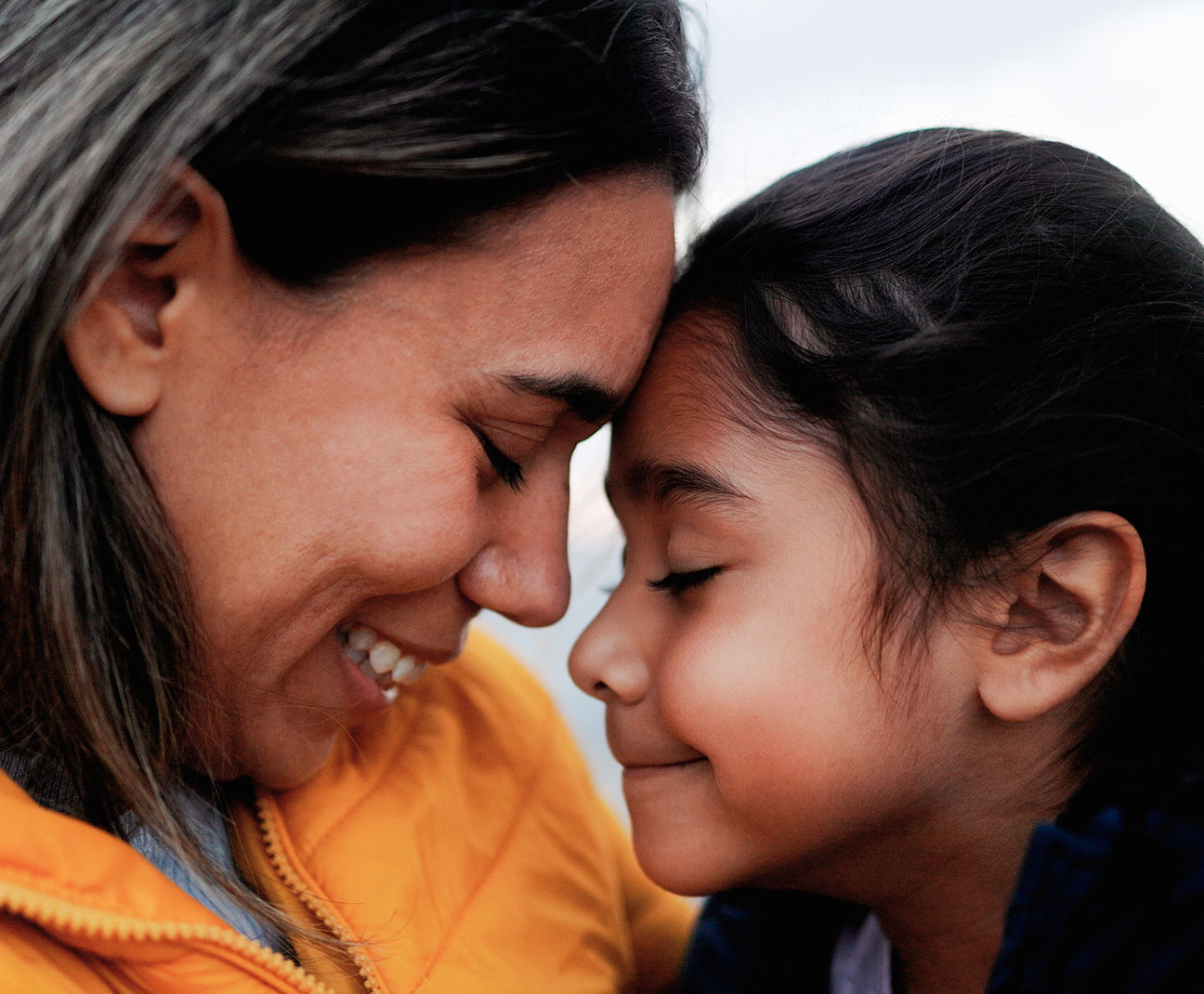 mother and daughter embracing