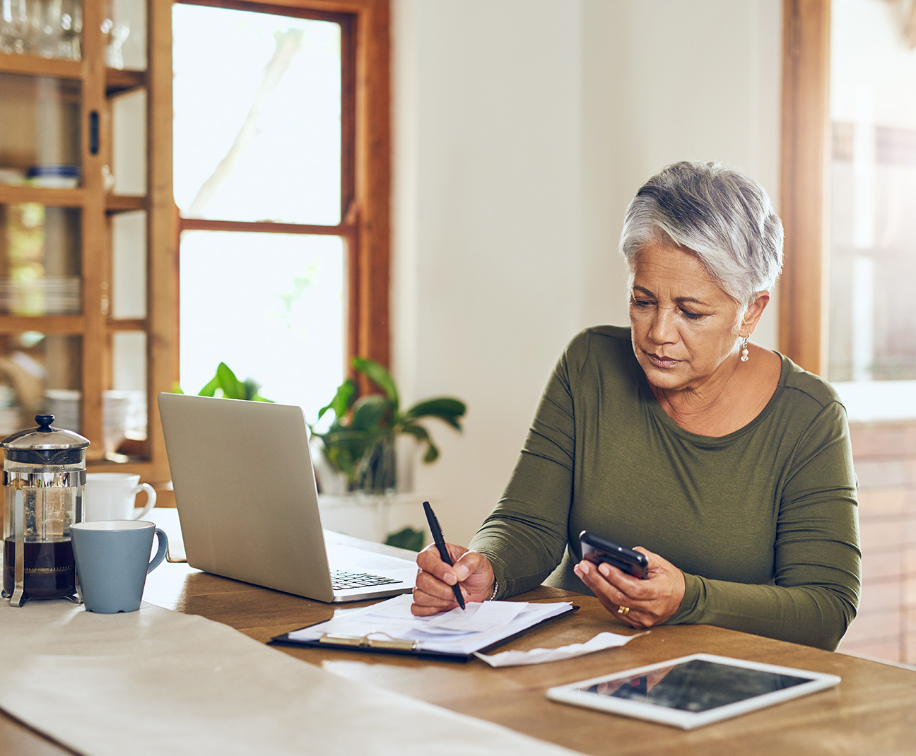 old woman working on finances