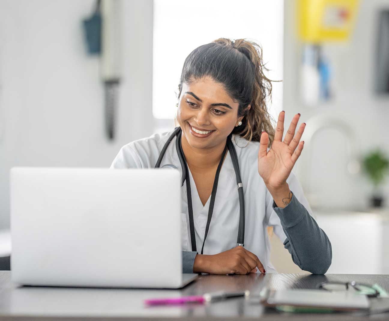 Doctor waving to a client