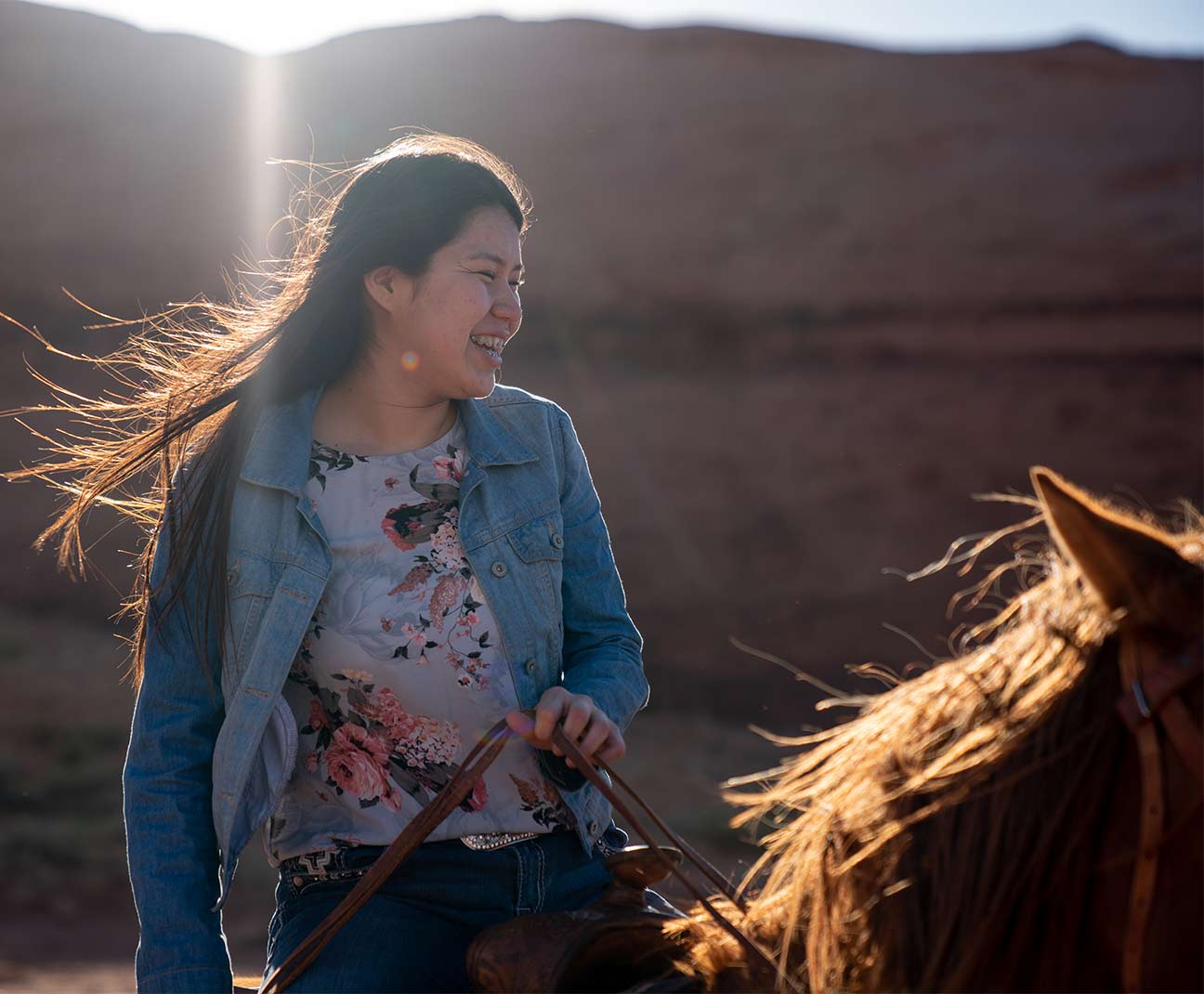 Teen girl riding a horse