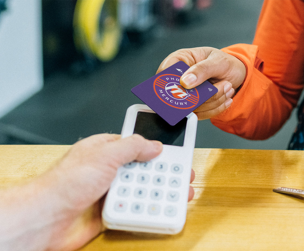 Woman using a tap-to-pay credit card