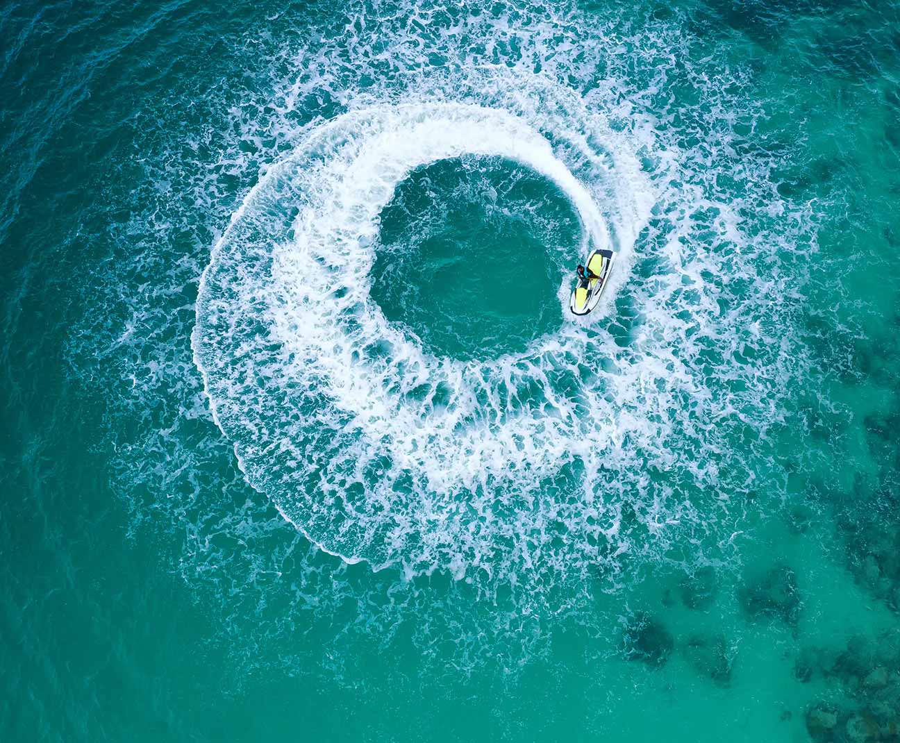 person riding jetski watercraft