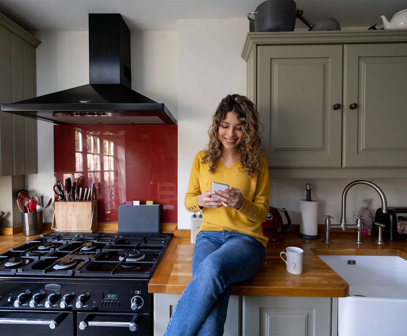 Woman sitting in kitchen