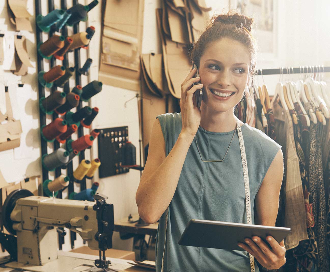 Woman holding cellphone and tablet