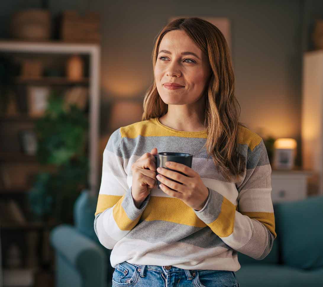 Woman in cozy living room