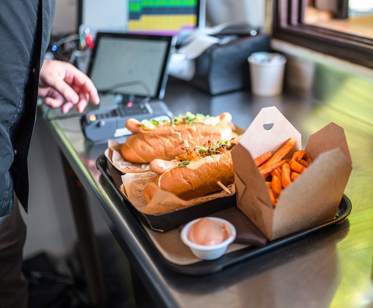 Person paying for lunch with their Mountain America card