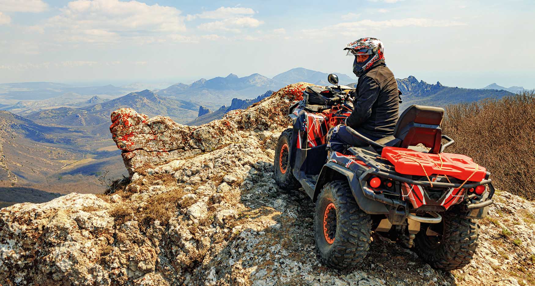 riding an atv in the mountains