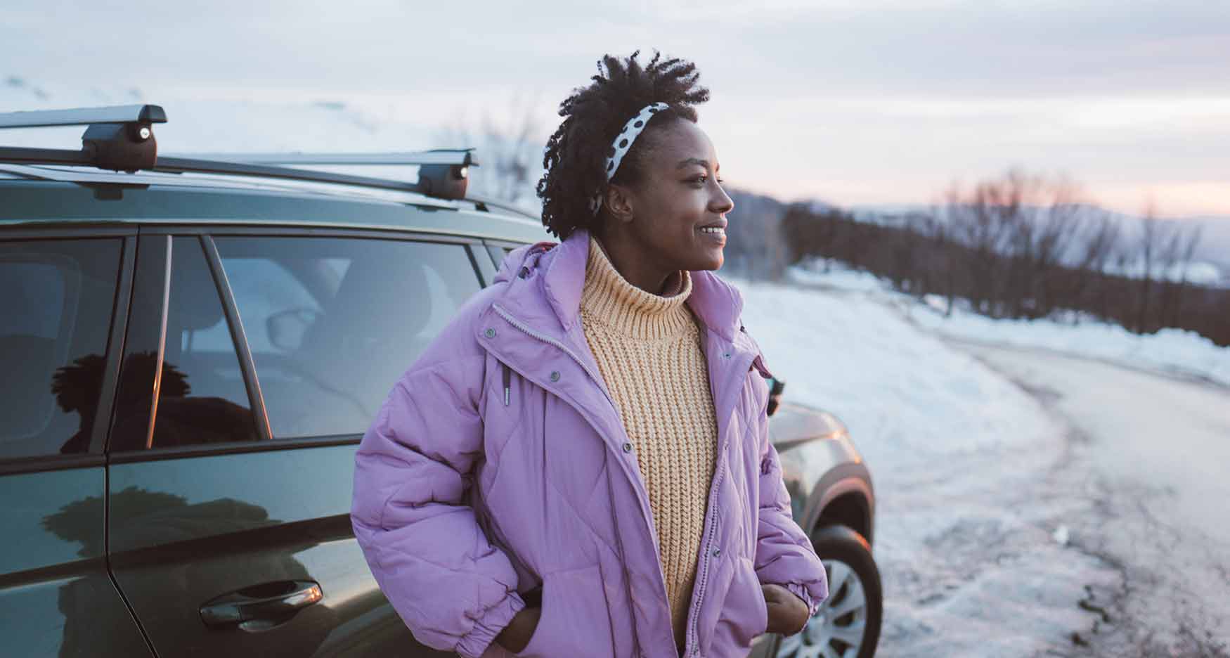 Woman standing next to her car