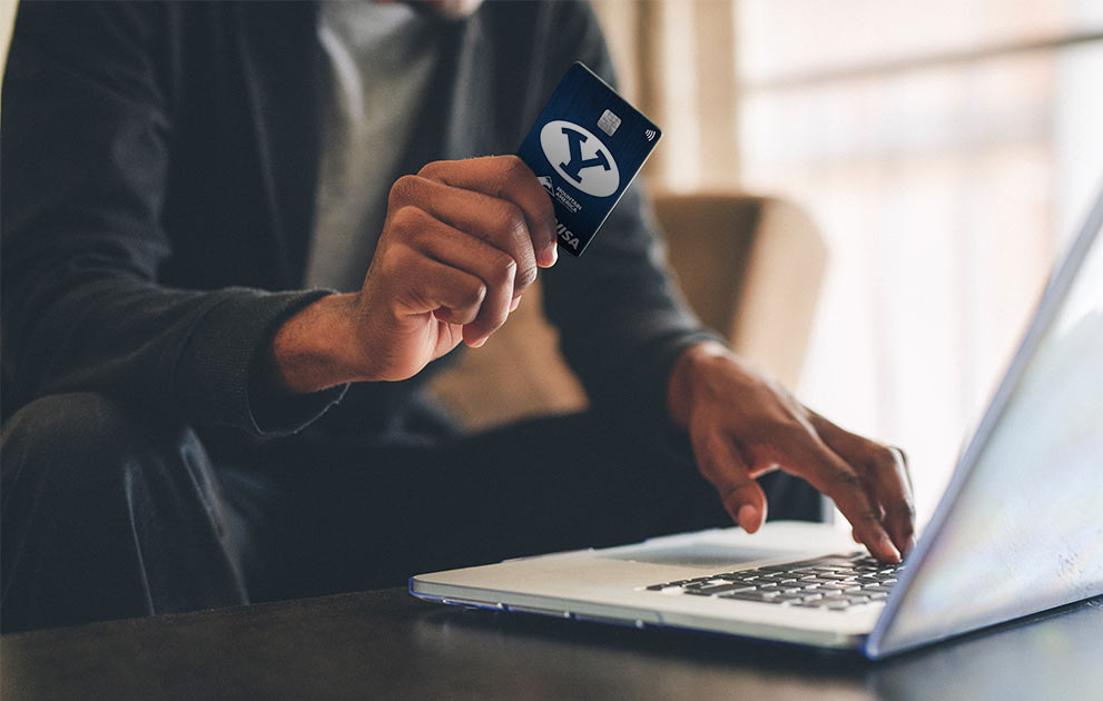 Man shopping online with BYU card