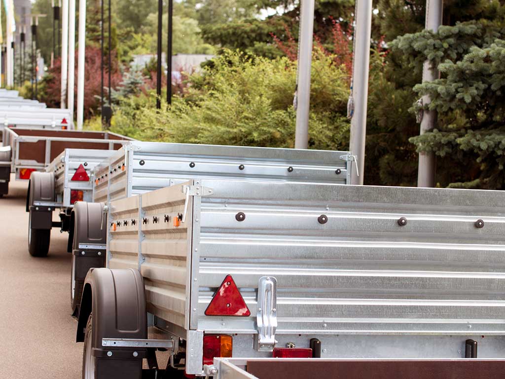 line of silver cart trailers