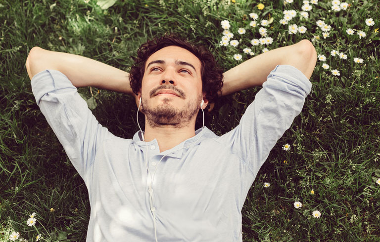 Man relaxing on his lawn