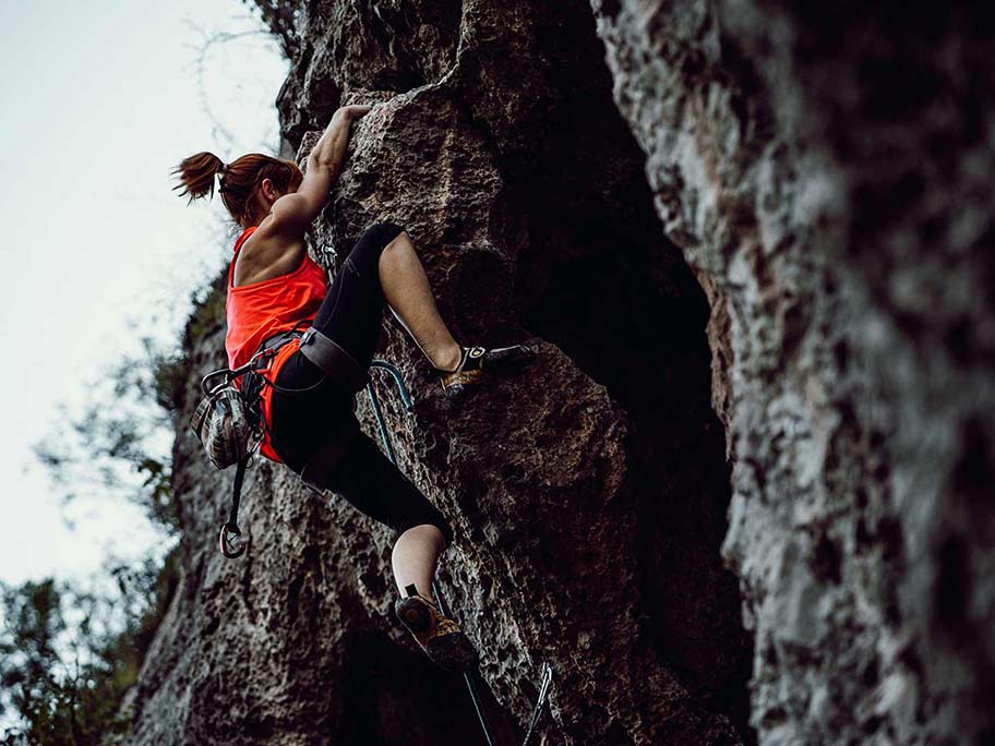 woman rock climbing