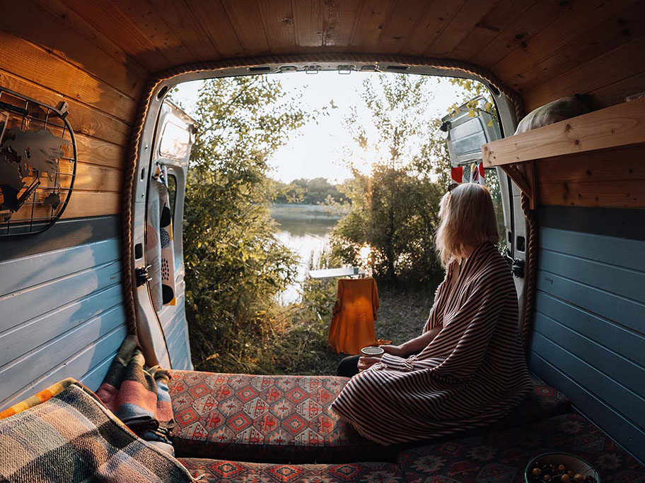 woman looking out the back of her van