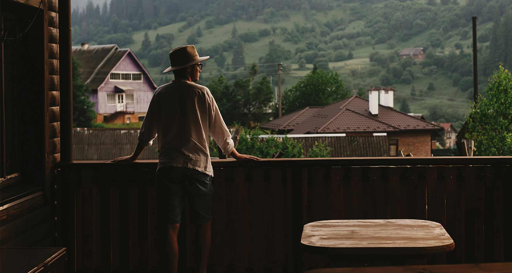 man standing on an outdoor deck