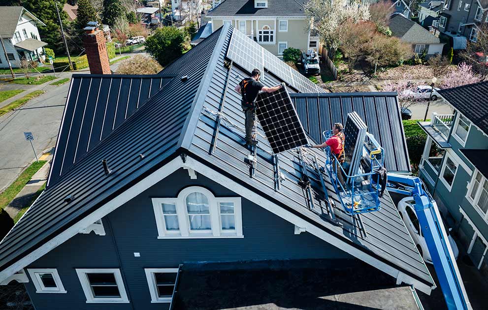 Solar panels getting installed on a house