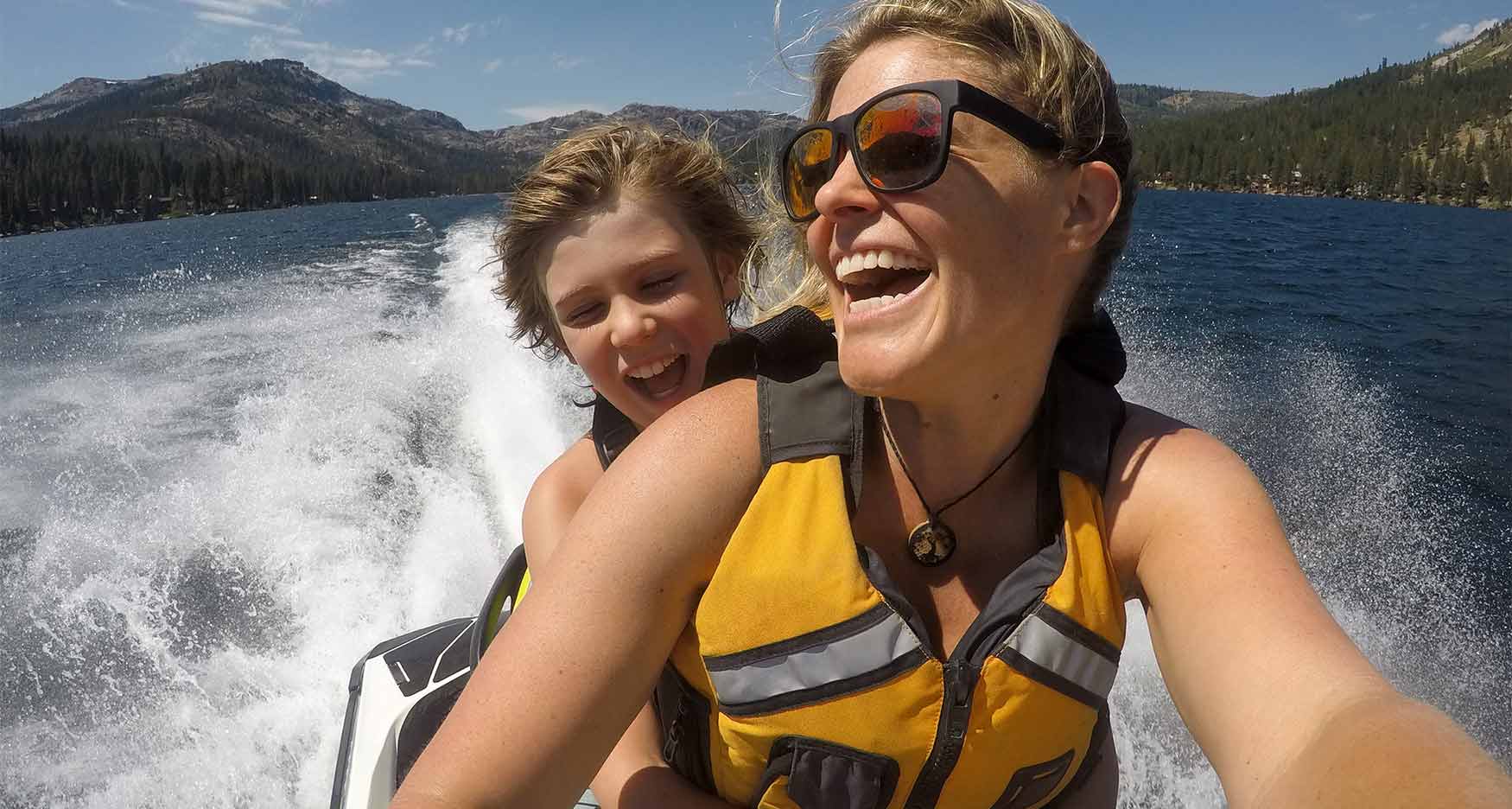 mother and son riding a waverunner