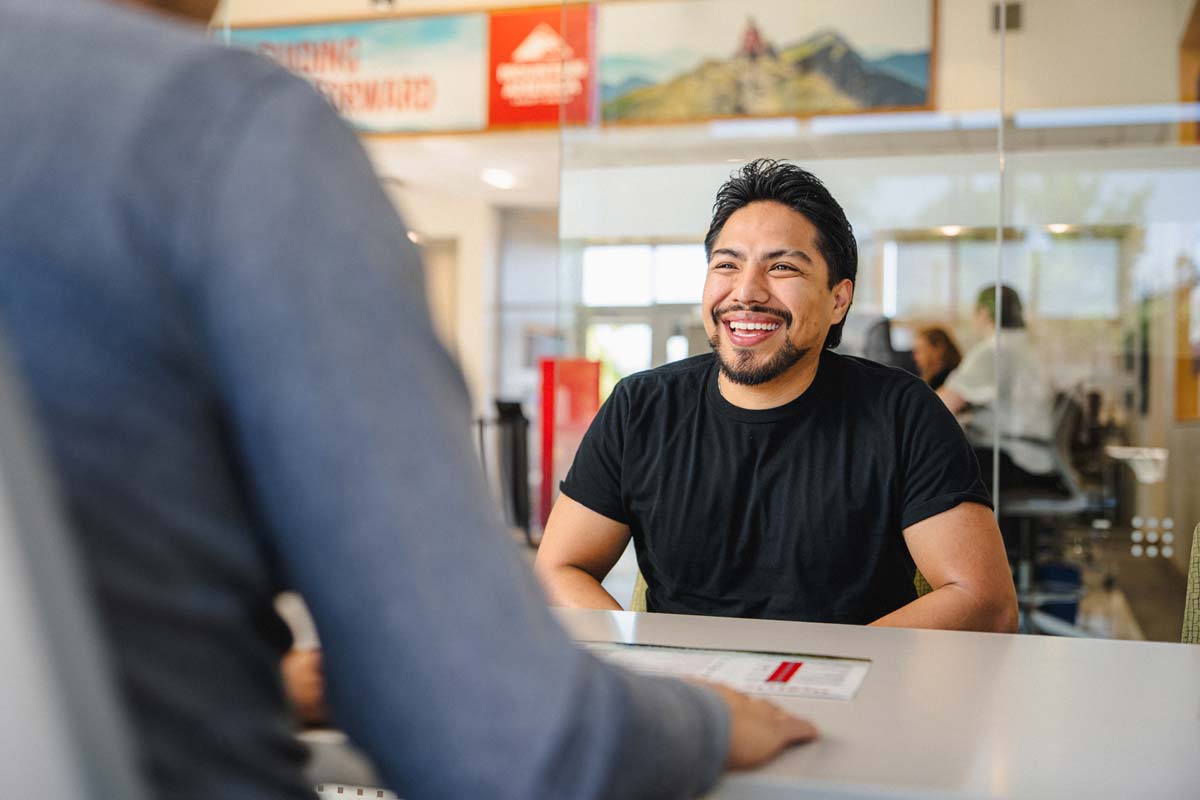 Man being coached by employee