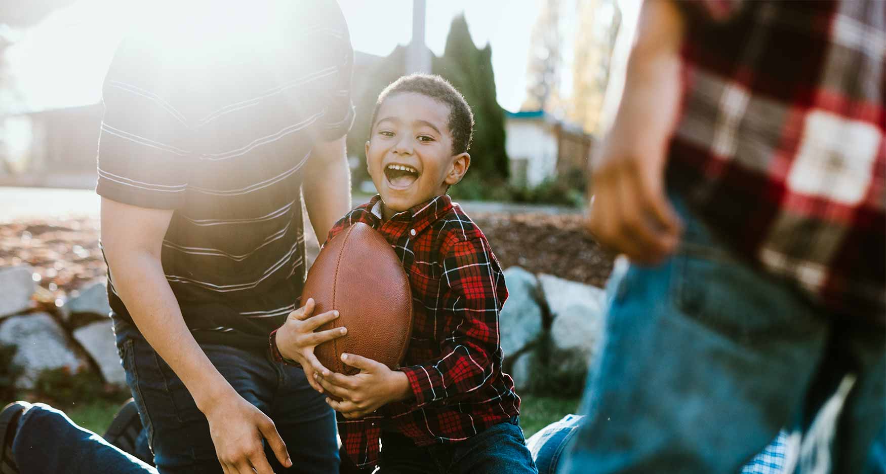 Family playing football together