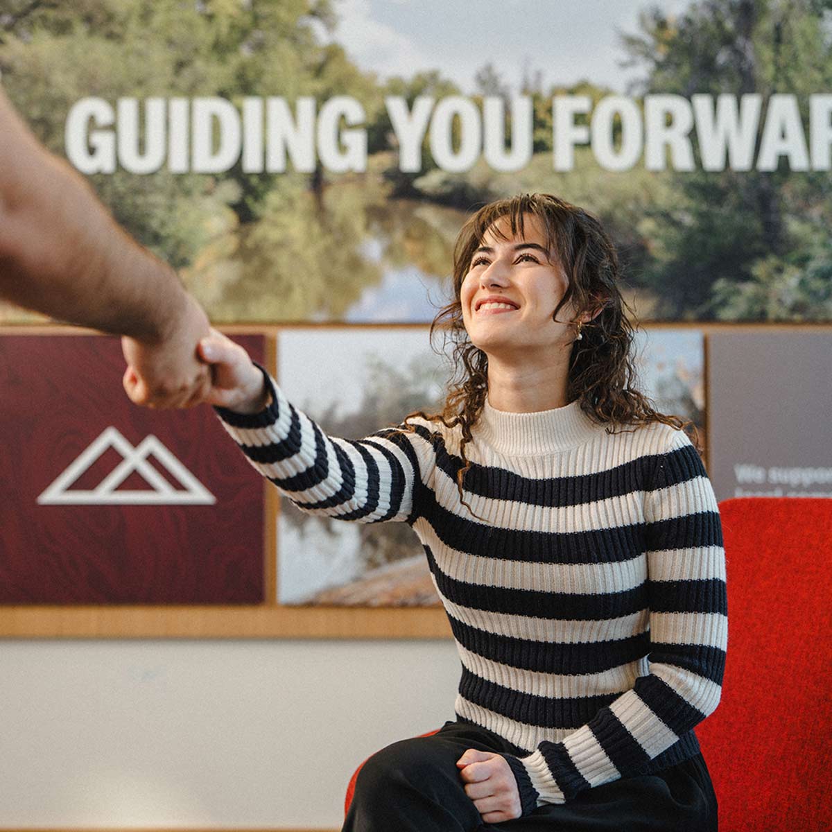 Employee shaking a member's hand