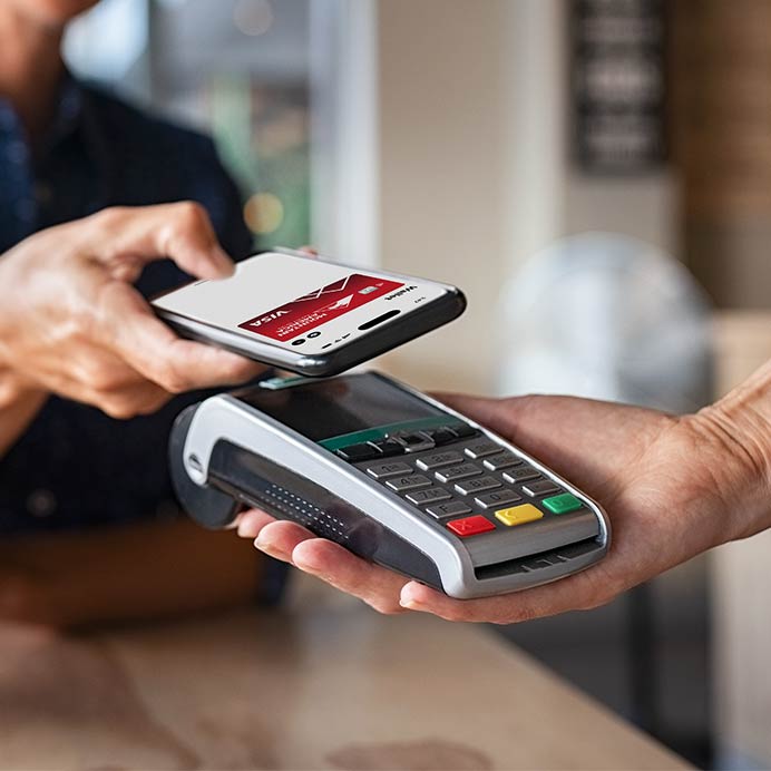 Someone using their Mountain America Card to pay
