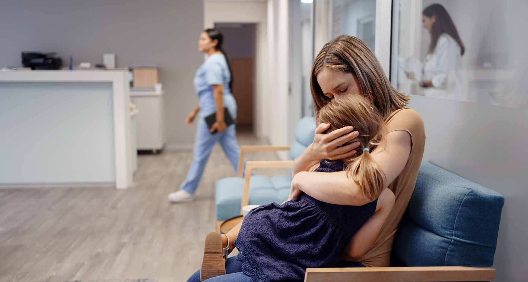 Mother holding a sick child