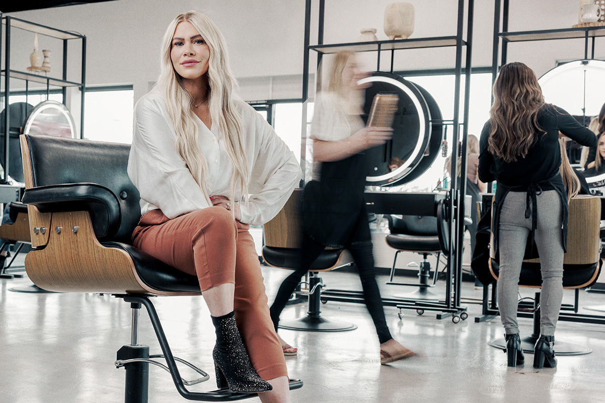 Woman sitting on hair salon chair