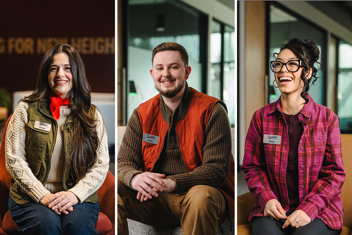 three credit union employees sitting and smiling