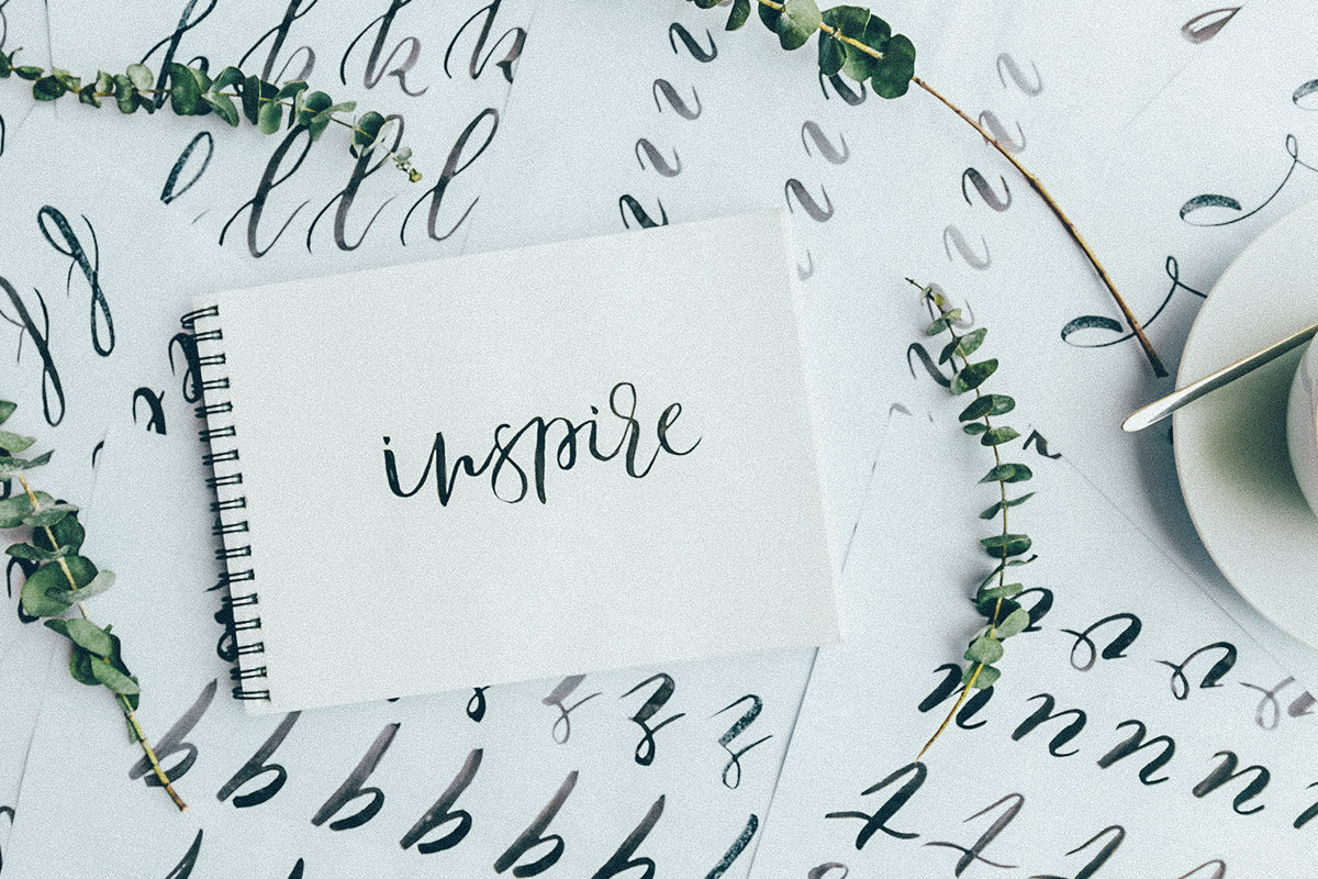 journal with "inspire" written in it
