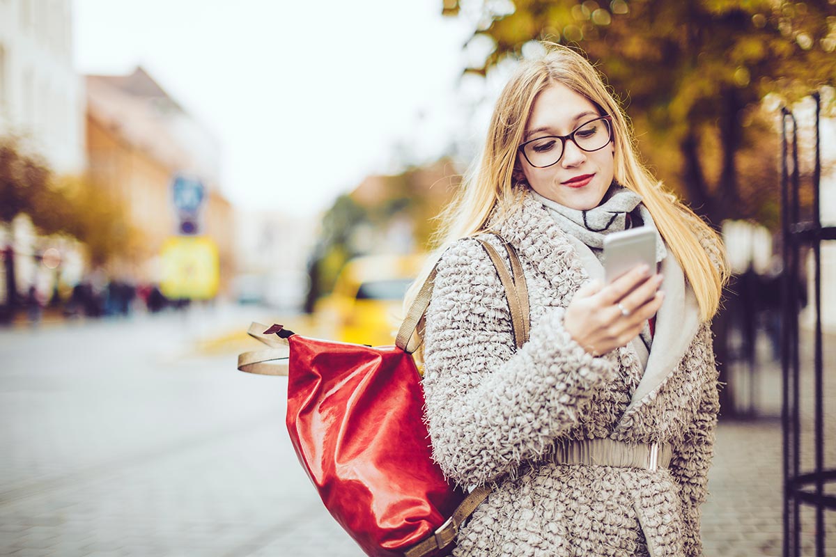 woman on her phone outside