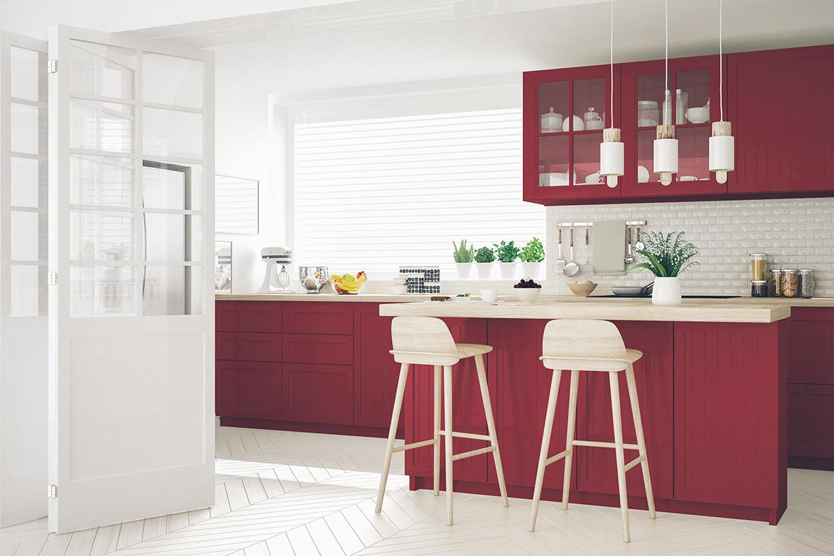 white kitchen with red cabinets