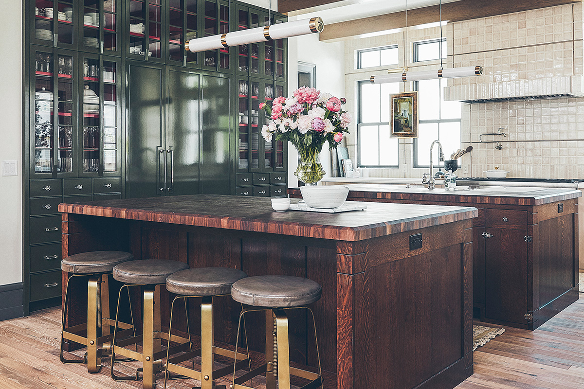 modern country kitchen with dark wood islands and dark green cabinets