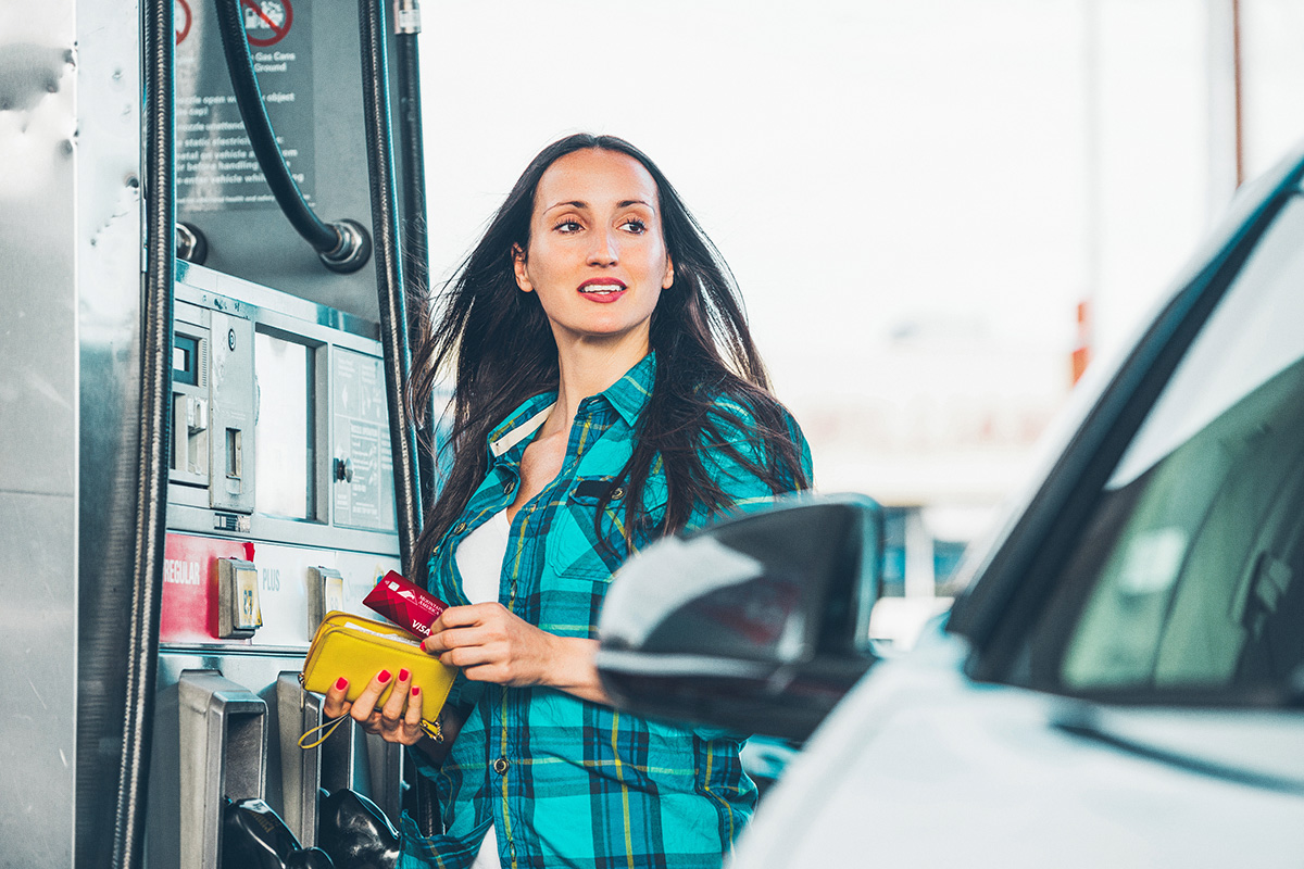 woman paying for gas with her Mountain America card