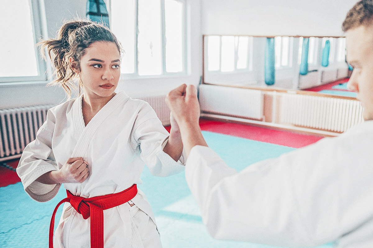 girl and guy doing karate