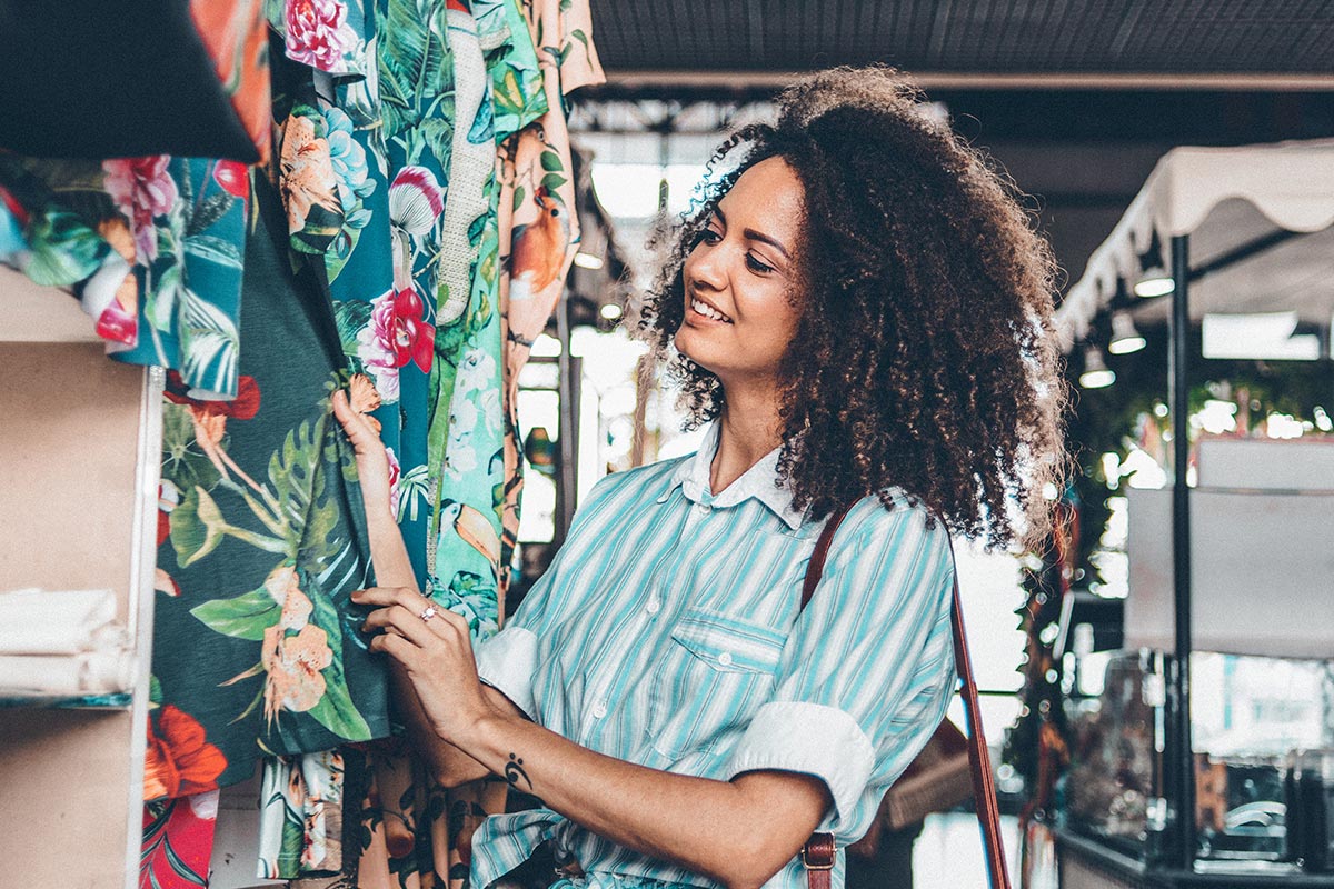 woman looking at clothes in a store