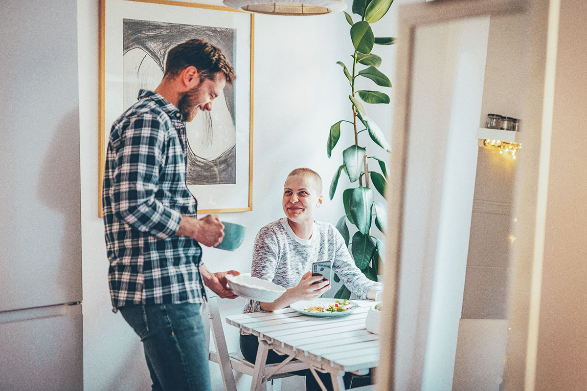 couple sitting down at the table to eat