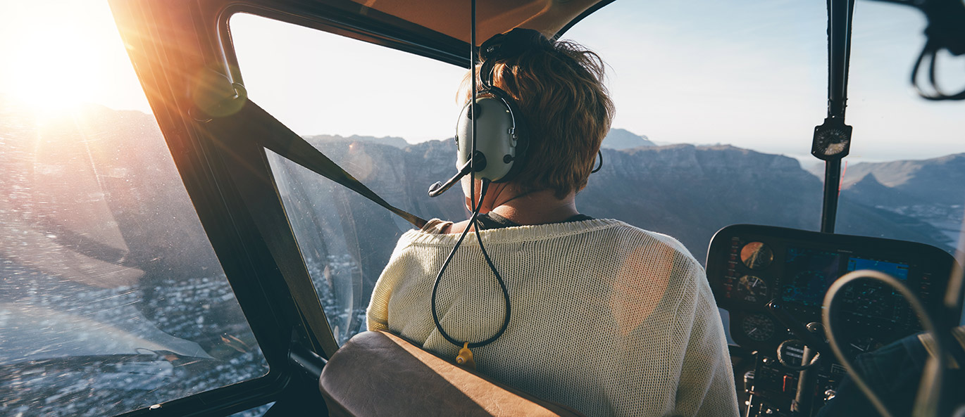 Woman riding in helicopter