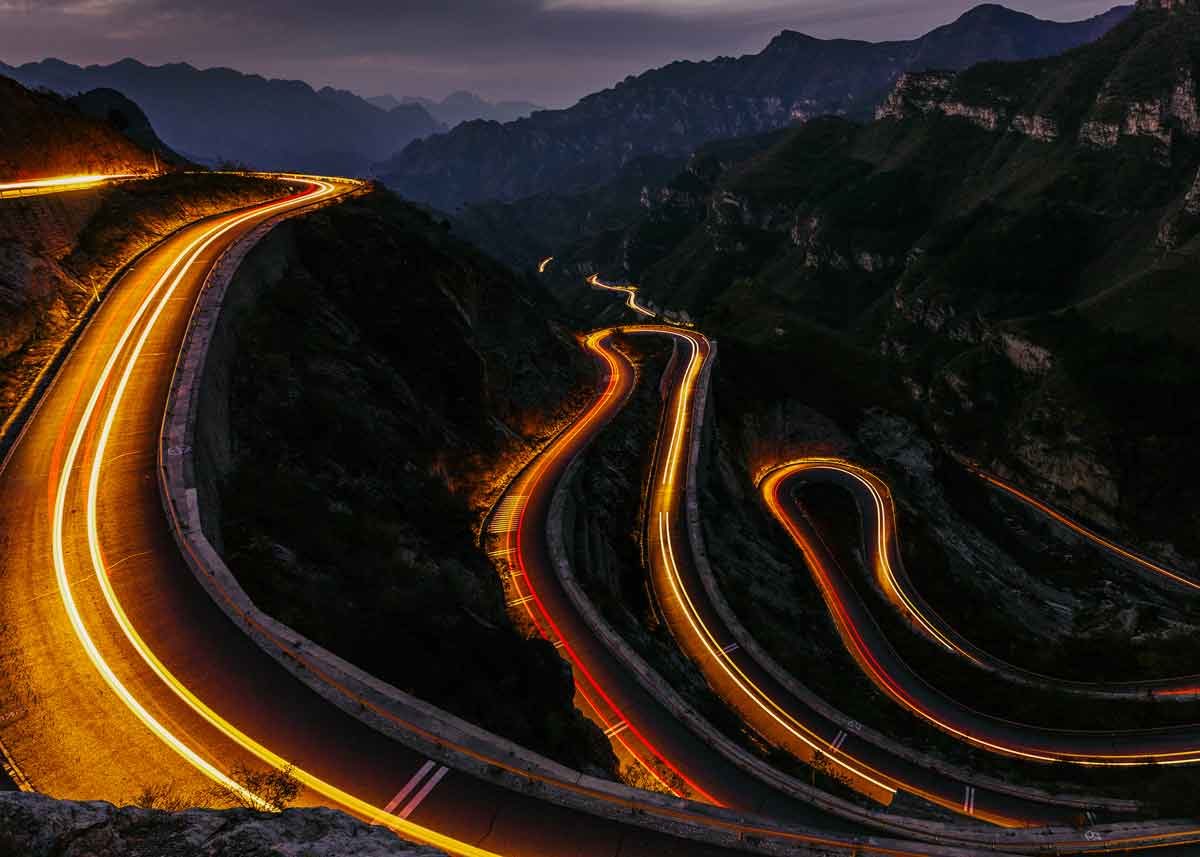 Winding mountain road at dusk