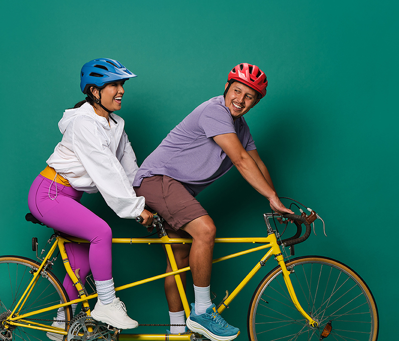 Couple riding a tandem bike